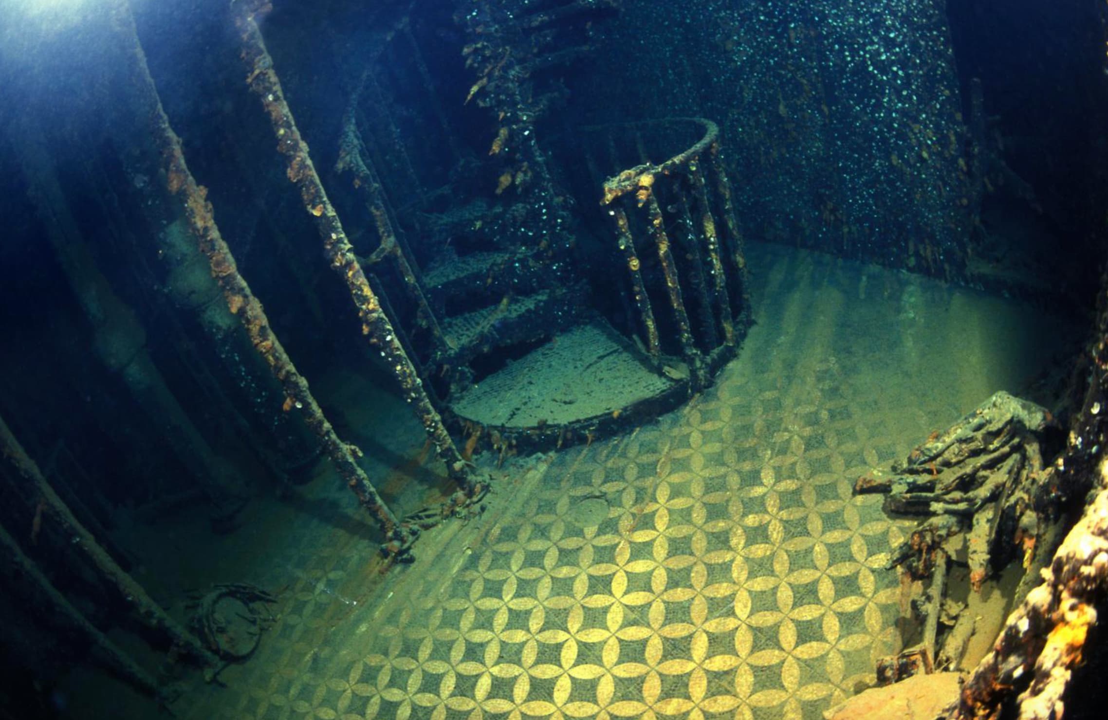 “Divers photograph inside the wreck Britannic, Sister of the Titanic, Sunk in the Aegean Sea in WW1.”